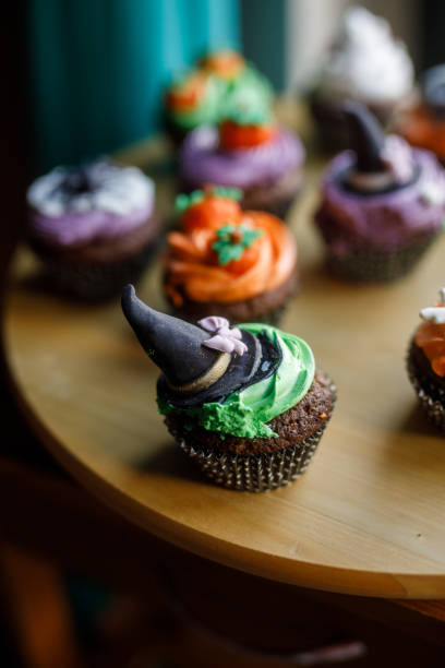istock Cute Halloween themed cupcakes served on a wooden plate 1969624897