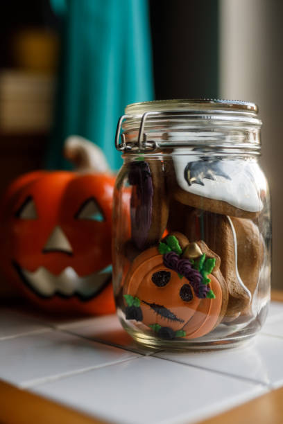 istock Cute Halloween themed cookies in a glass jar 1969625323