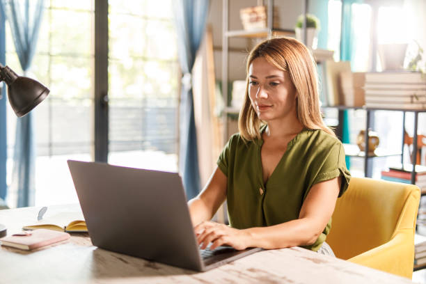 istock Charming woman working at home office desk 1969629194