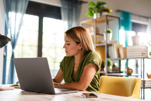 istock Charming woman working at home office desk 1969629195