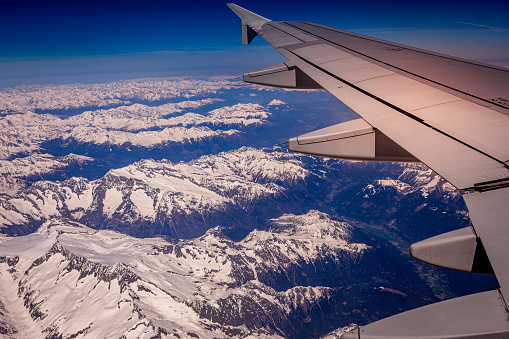 aerial view from airplane of the Alps over Zermatt, Switzerland, with snow, mountains and valleys