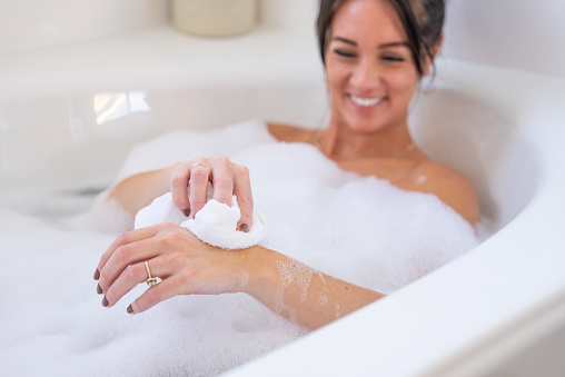 A woman enjoying a soothing bath.