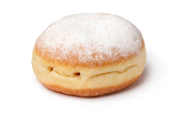 istock Single fresh baked Berliner donut covered with sugar close up on white background 1969702470