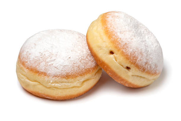 istock Pair of fresh baked Berliner donuts covered with white sugar close up 1969702999