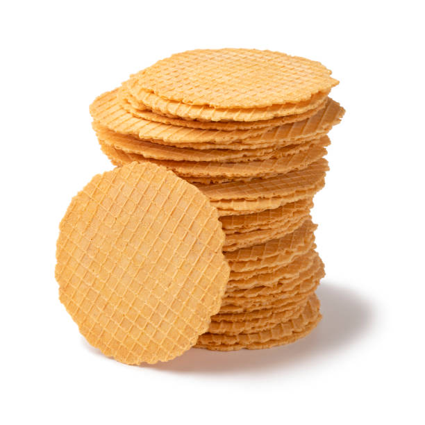 Stack of fresh homemade baked thin cheese waffles isolated on white background