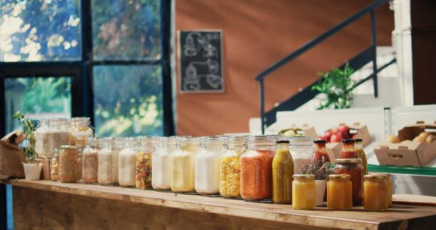 istock Pasta and sauces in reusable glass jars on store shelves 1969715746