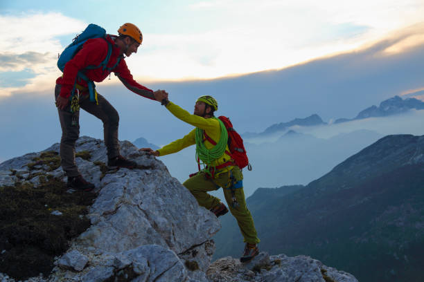 Helping hand in the mountains stock photo