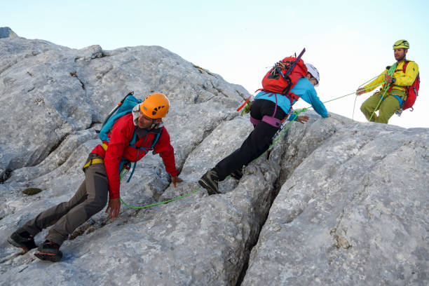 istock Group of mountain climbers on their way to the top 1969740120