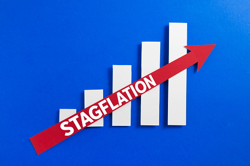 Growing bar graph with red rising arrow and stagflation text