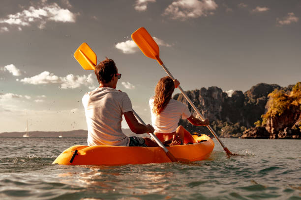 istock Young couple is walking on sea kayak 1969766903