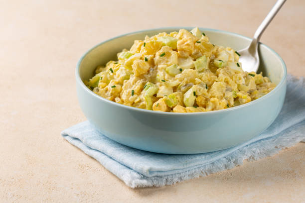 istock Potato salad made from boiled potatoes, boiled eggs, onions, celery, mustard, pickle, mayonnaise and paprika dressing. 1969817502