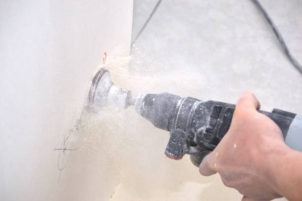 istock drilling holes in the wall 1969828727