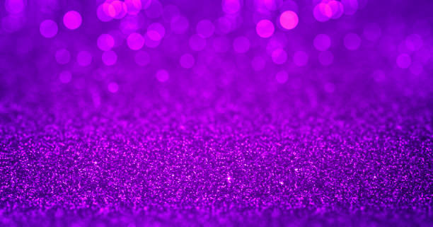 istock Sparkling purple magenta glitter background with bokeh. Closeup view, dof. Pattern with shining fine purple sequins. Festive luxury magenta background, backdrop, texture. Design element 1969832500