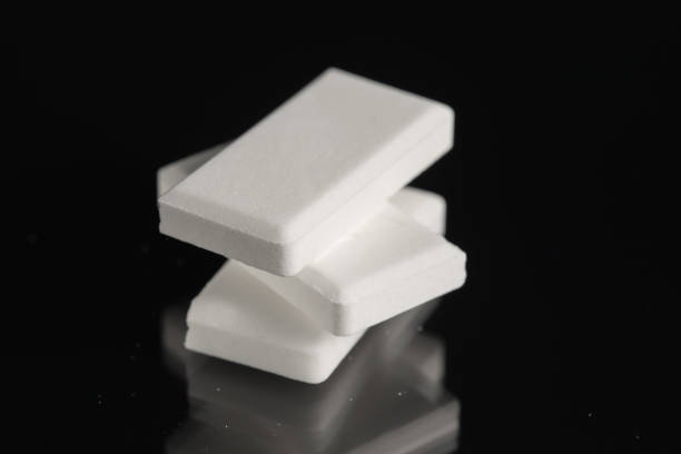 istock Stack of glucose dextrose candies on black background. Close-up. 1969850813