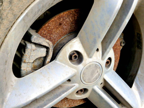cut disc brake lining. parking for a long time in one place took its toll on condition of vehicle, which had to replace the brakes. car service advertisement and warning for drivers who rarely drive, axle, brake lining, pad, disc, blocked, brake shoe