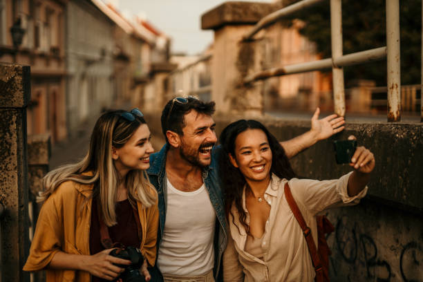 istock Diverse group of friends joyfully navigating the city streets 1969895292