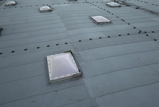 Full frame of orange colored tiles a bit weathered on roof top