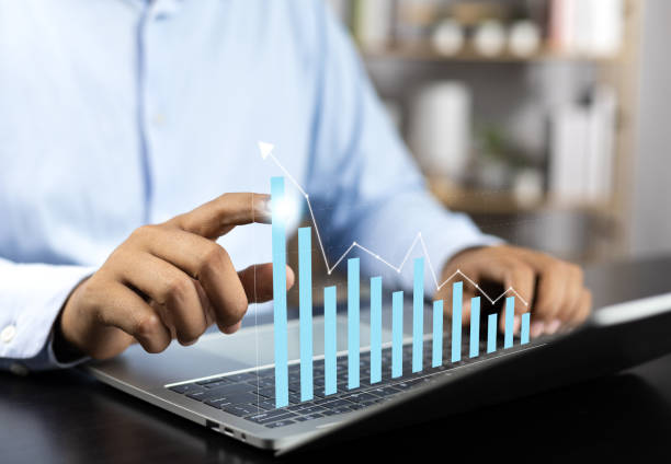 istock Business strategy analysis by executive measuring success and improving performance.Company performance for financial goals success. Businessman calculates financial data for long term investment. 1969933453