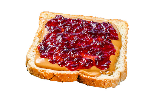Peanut butter and jelly on white bread toasts.   Isolated on white background. Top view