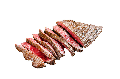 Grilled and cut flank steak. Marble beef meat.  Isolated on white background. Top view