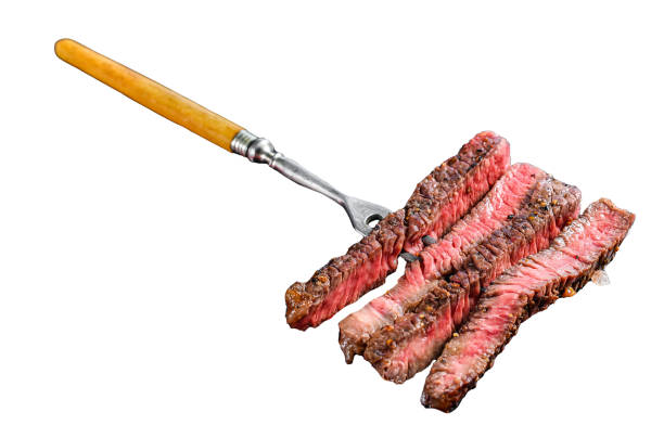 istock Grilled sliced Denver steak. Barbecue beef. Isolated on white background. Top view. 1969955818