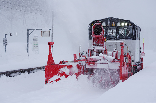Nikii-cho, Hokkaido, Japan - January 27, 2024 : Snow removal train to fly snow at the Ginzan station