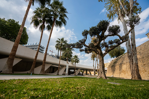 Sabadell - Catalonia, SPAIN - March 20th of 2021: wide view of the top area of the park of Can Gambus with the old Masia on the background