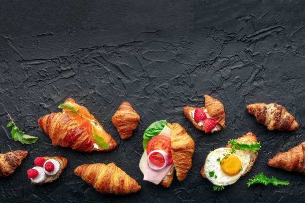 croissant sandwich assortment. various stuffed croissants, overhead - fried egg lettuce vegetable lunch photos et images de collection