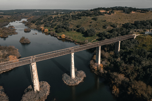 Old railway bridge over the Guadiana river valley in Serpa Portugal