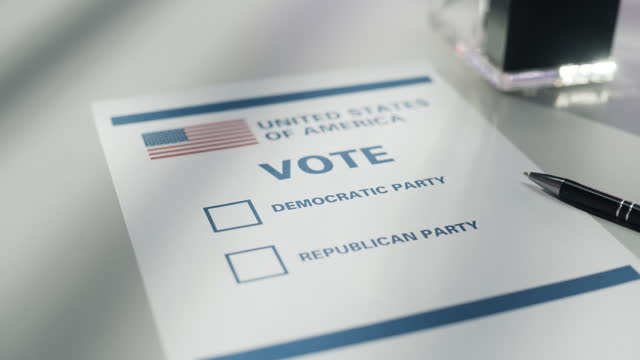 Close Up Footage of a Paper Ballot in a Voting Booth on the Day of National Elections in the United States of America. Democratic and Republican Two-Party System Options are Written on a Document