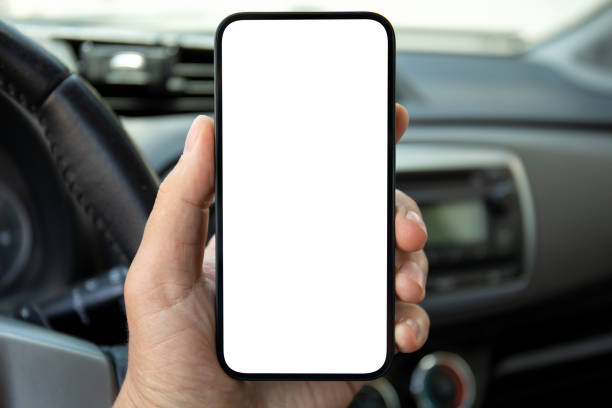 istock man hand holds phone with isolated screen on background car 1969992050