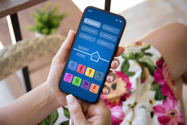 istock woman hand hold phone with application smart home on screen 1969995791