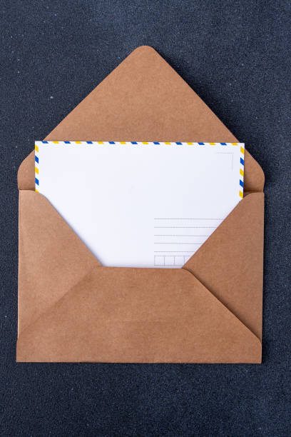 istock Open craft brown envelope and postcard form. Letter with copy space. Mail card 1970002368