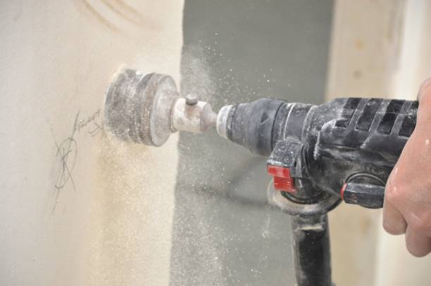 istock drilling holes in the wall 1970004565