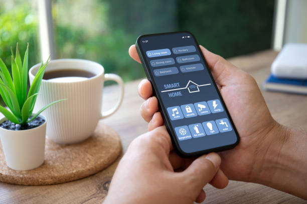 istock man hand hold phone with application smart home on screen 1970006325