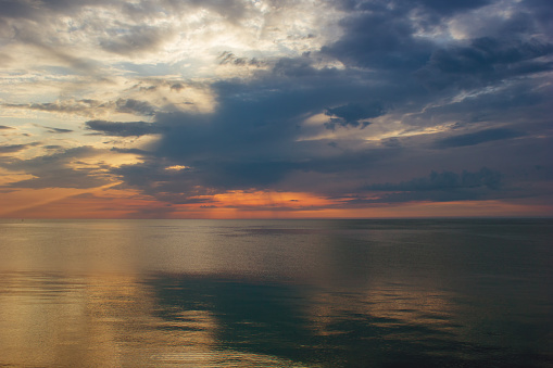Beautiful sunrise over Black Sea, no wind, perfect clouds and surface.
