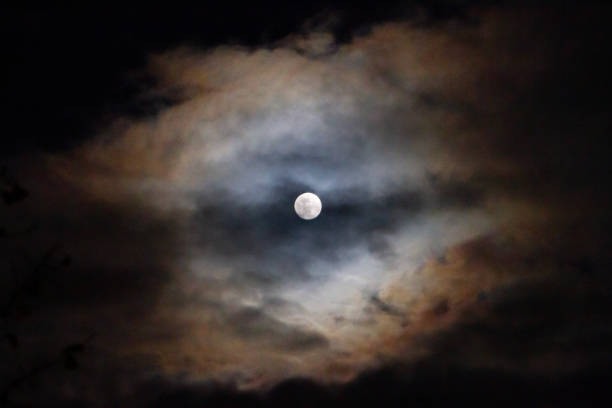 istock Full moon with colorful clouds in orange and blue 1970046841