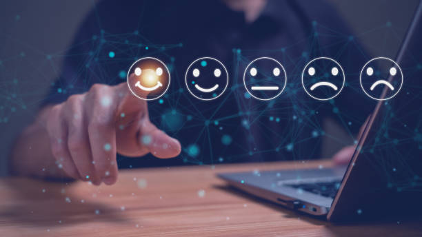 istock Businessman selects virtual screen with happy smiley icon to give service satisfaction, satisfied, customer service concept, feel good, very happy. 1970050051