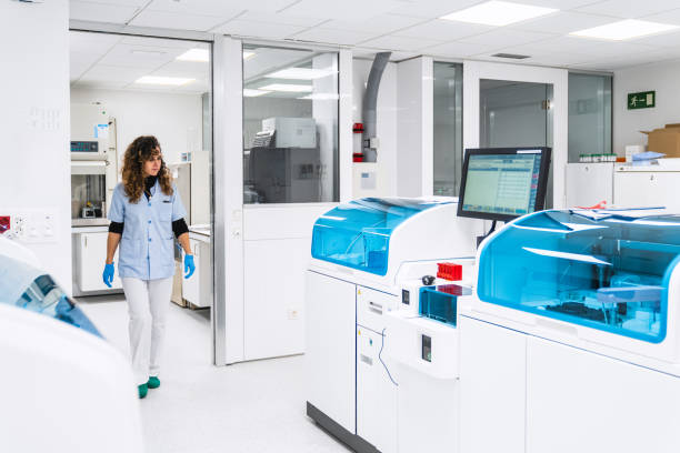 istock Medical Staff Walking Through Clinical Lab with Diagnostic Machines 1970056288