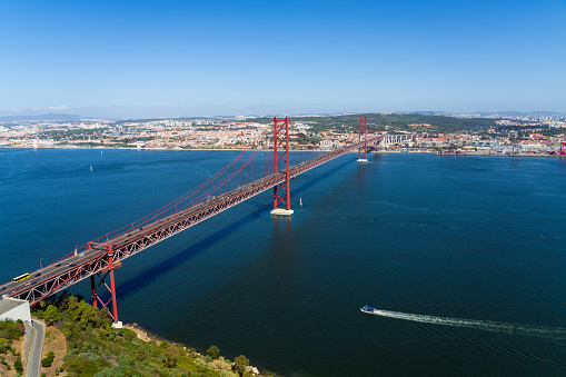 April 25th bridge crossing Tagus river in Lisbon, Portugal.