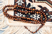 Prayer bread or Islamic tasbih.debgan prayer mat background Suitable as a background for design concepts with the theme of Ramadan or other Islamic religious events.