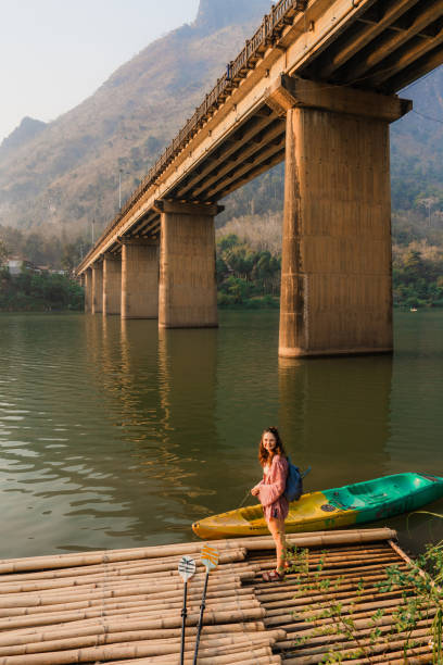 istock Woman canoeing on Mekong river in Laos 1970097567