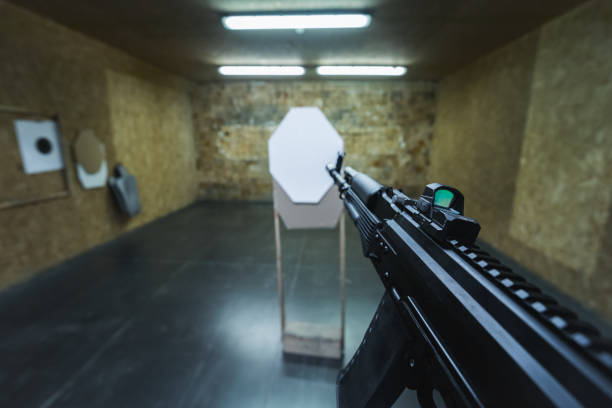 Tactical ak 74m rifle shooting at a paper target at a shooting range. High quality photo