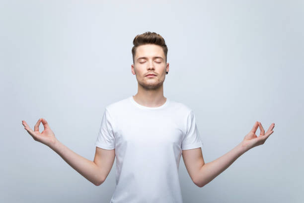 istock Portrait of young man meditating 1970137389