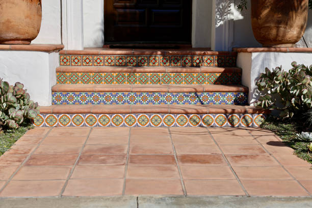 Brightly colored ceramic tiles on the terracotta steps leading upwards