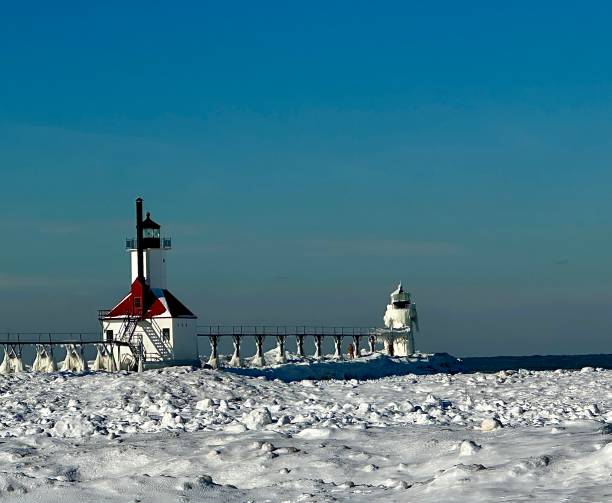 Saint Joseph Michigan lighthouse in winter ￼with snow and ice buildup.￼￼