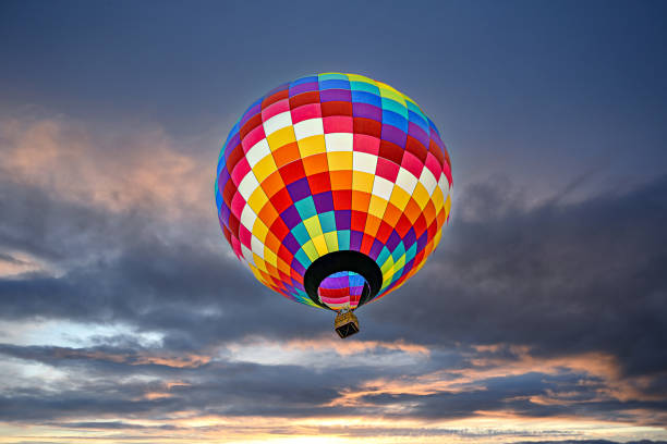 istock Colorful hot air balloon flying at sunset 1970296414