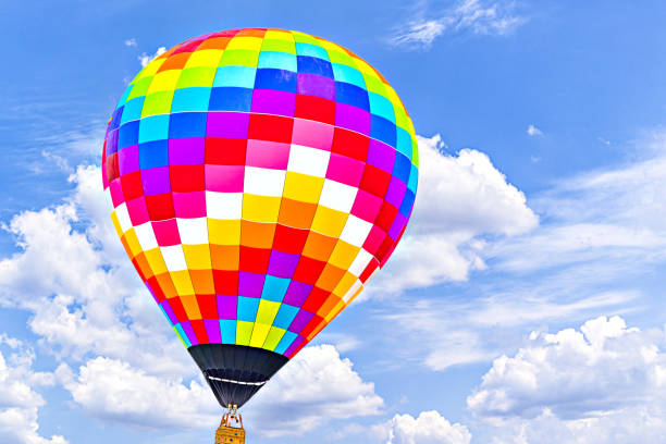 istock Hot air balloon flight over blue sky 1970296415