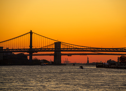 Manhattan Bridge and Brooklyn Bridge at sunset in New York City, USA