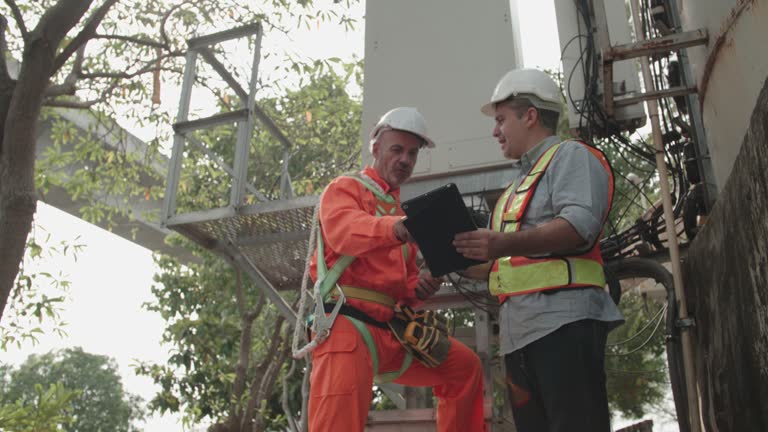 Two engineer discuss for plan to survey site construction